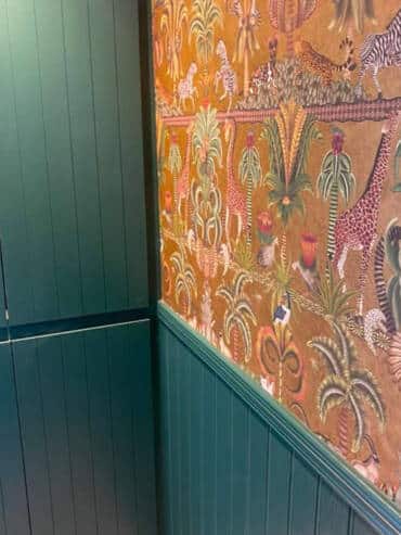 Wallpaper over wood panelling