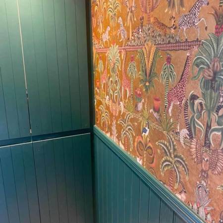 Wallpaper over wood panelling